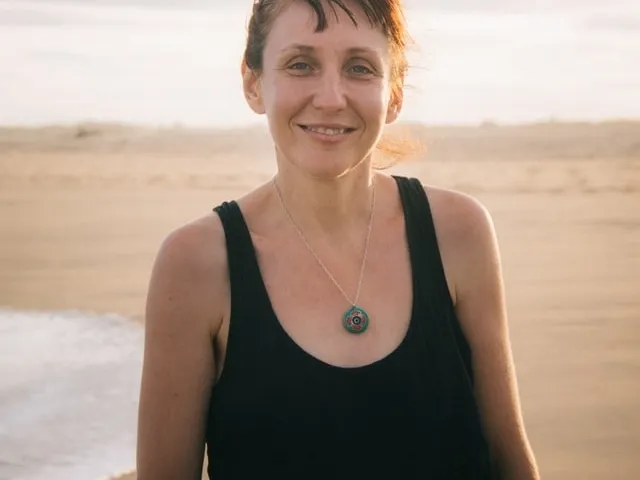 happy middle aged woman at the beach 640