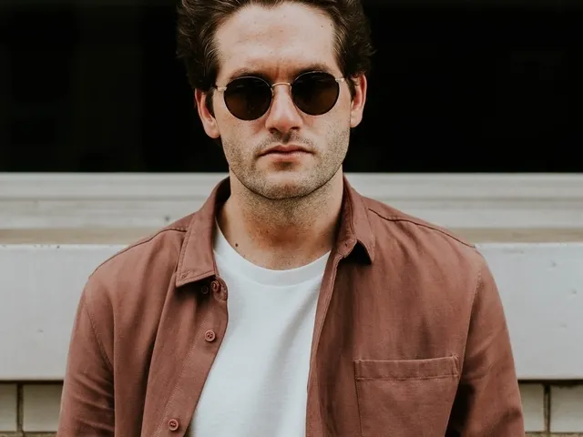 young man wearing brown sunglasses 640