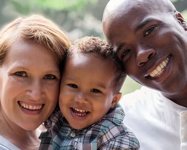 Mother Father and Son, multicultural family checking for eye disease.