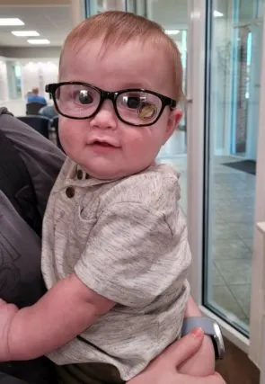 baby wearing eyeglasses