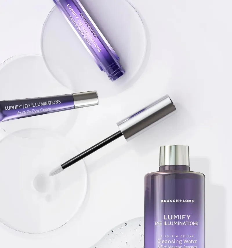Purple LUMIFY eye care products and applicator on white table
