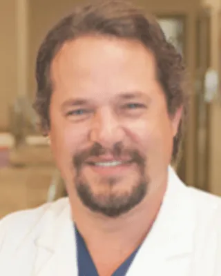 William B. Plauche, M.D.